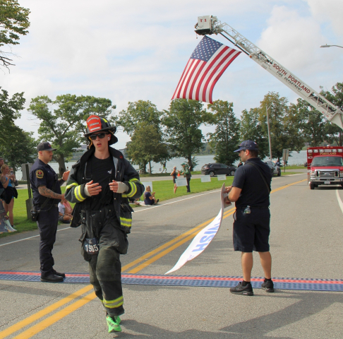 Winning first responder in gear Andrew Doughty from St. Albans, Maine finishing in a time of 35:35